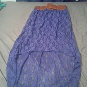 A long floral skirt with a brown belt